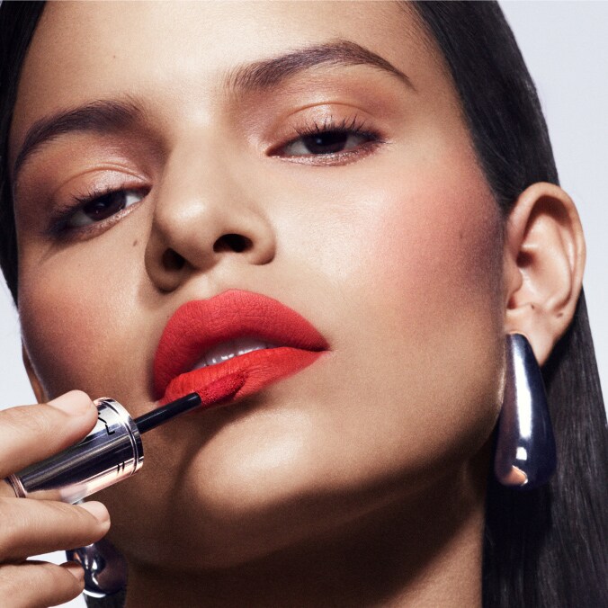 Model with MAC Cosmetics product.